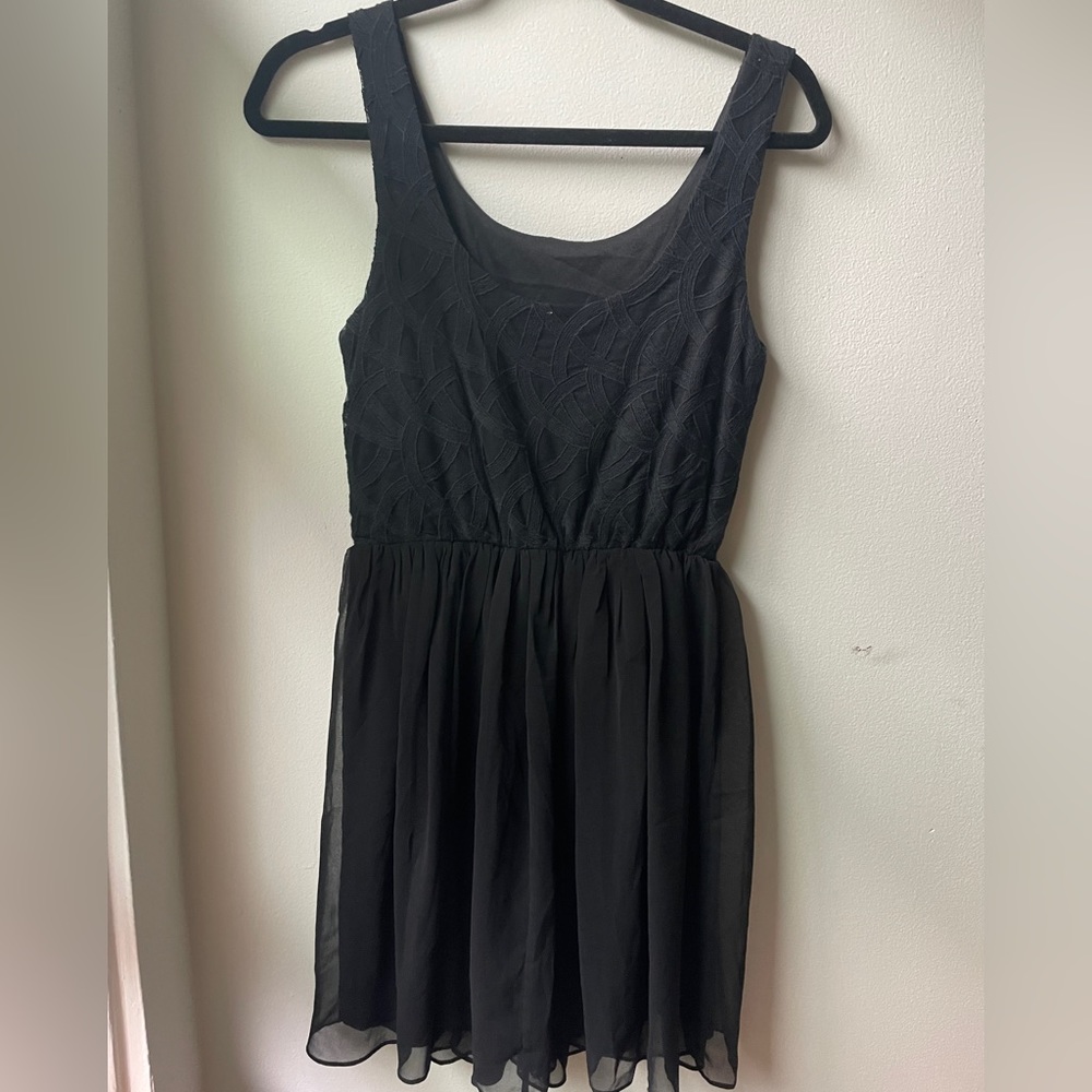Black mini dress size small. Embroider detail on top.